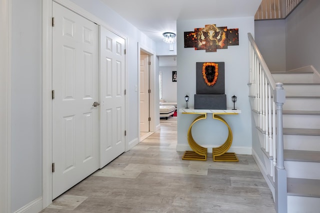 5 Teramar Way, White Plains, NY 10607 - foyer entrance with light wood finished floors, stairway, and baseboards