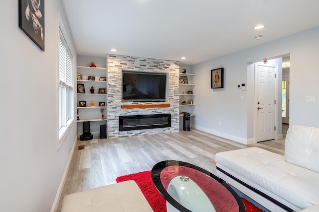 5 Teramar Way, White Plains, NY 10607 - living area with plenty of natural light, wood finished floors, baseboards, a large fireplace, and recessed lighting