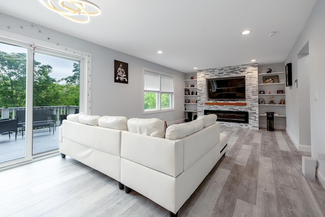 5 Teramar Way, White Plains, NY 10607 - living area featuring light wood finished floors, baseboards, a large fireplace, built in shelves, and recessed lighting