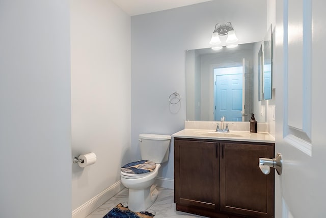 5 Teramar Way, White Plains, NY 10607 - half bathroom featuring marble look tiles, toilet, vanity, and baseboards