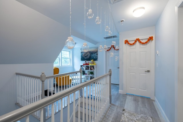 5 Teramar Way, White Plains, NY 10607 - hallway featuring an upstairs landing, wood finished floors, vaulted ceiling, and baseboards