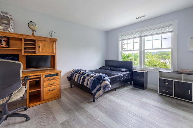 5 Teramar Way, White Plains, NY 10607 - bedroom featuring light wood-style floors, baseboards, and an office area