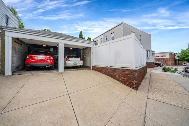 79-48 67th Rd, Middle Village, NY 11379 - view of side of home with a garage