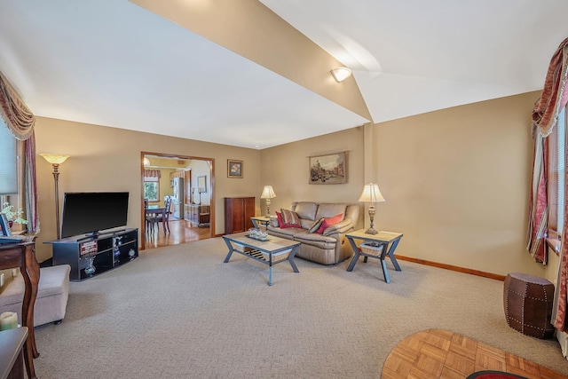 79-48 67th Rd, Middle Village, NY 11379 - carpeted living room featuring baseboards and vaulted ceiling