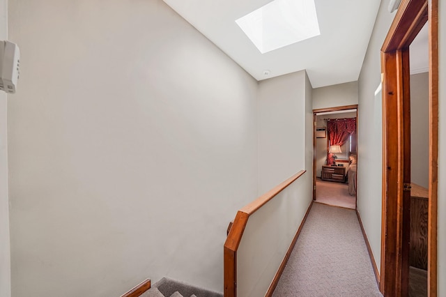 79-48 67th Rd, Middle Village, NY 11379 - hallway featuring a skylight, carpet flooring, and baseboards