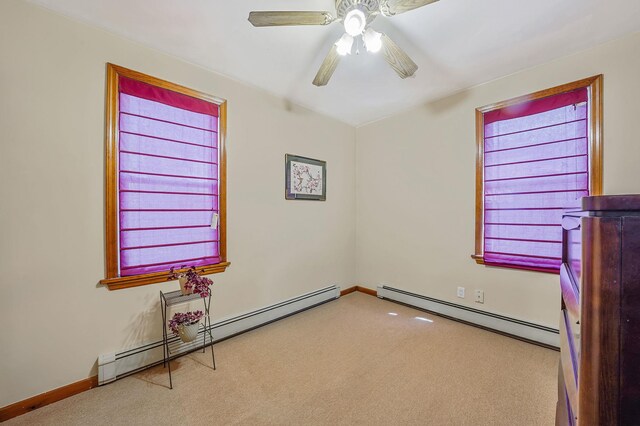 79-48 67th Rd, Middle Village, NY 11379 - carpeted spare room featuring baseboard heating, a ceiling fan, and baseboards