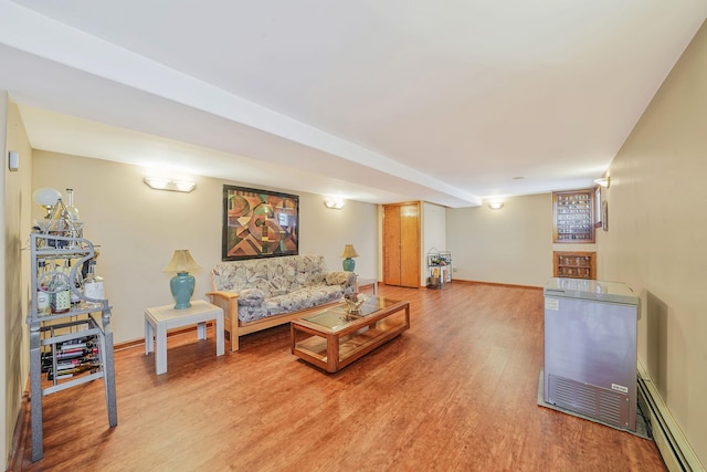 79-48 67th Rd, Middle Village, NY 11379 - living area featuring light wood-type flooring, a baseboard radiator, and baseboards