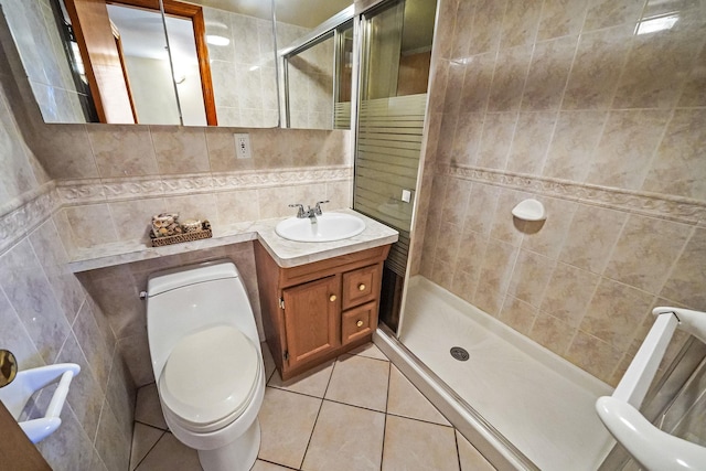 79-48 67th Rd, Middle Village, NY 11379 - bathroom with a shower stall, tile walls, tile patterned floors, vanity, and toilet