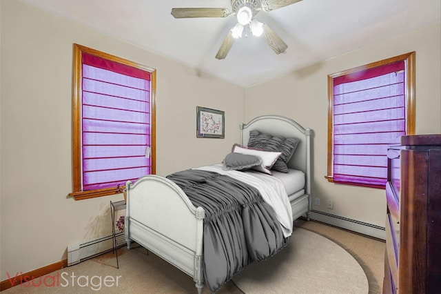 79-48 67th Rd, Middle Village, NY 11379 - bedroom with a baseboard radiator, carpet flooring, baseboards, and a ceiling fan