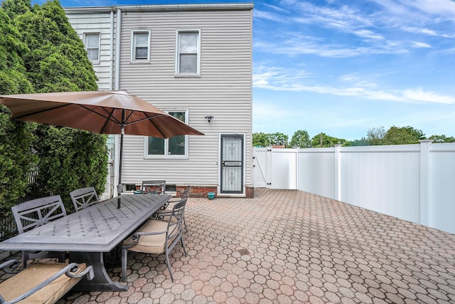 79-48 67th Rd, Middle Village, NY 11379 - fenced backyard with outdoor dining area and a patio area