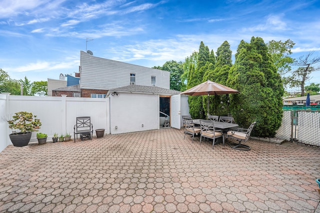 79-48 67th Rd, Middle Village, NY 11379 - fenced backyard with a patio and an outdoor structure
