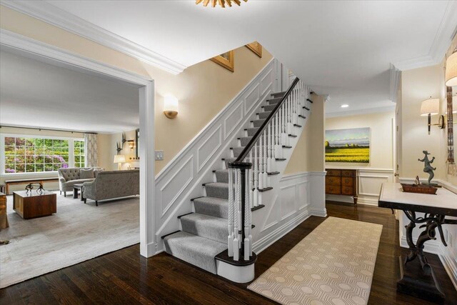 35 Seville Ave, Rye, NY 10580 - staircase with crown molding, hardwood / wood-style flooring, wainscoting, a decorative wall, and recessed lighting