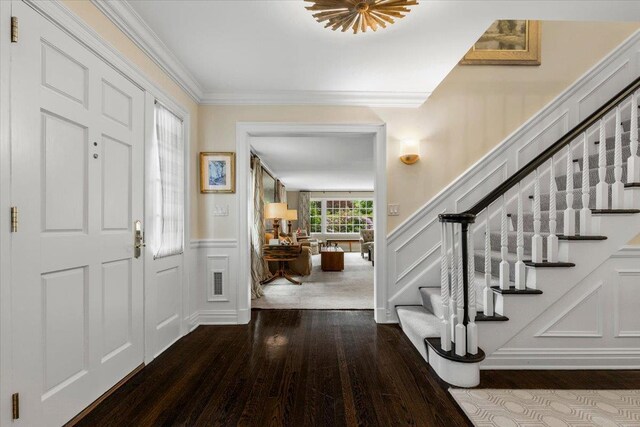 35 Seville Ave, Rye, NY 10580 - foyer featuring wood-type flooring, a decorative wall, stairs, crown molding, and a wainscoted wall
