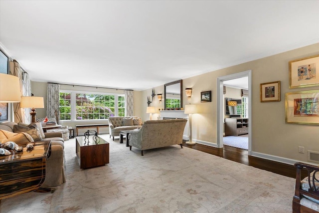 35 Seville Ave, Rye, NY 10580 - living area featuring wood finished floors, baseboards, and crown molding