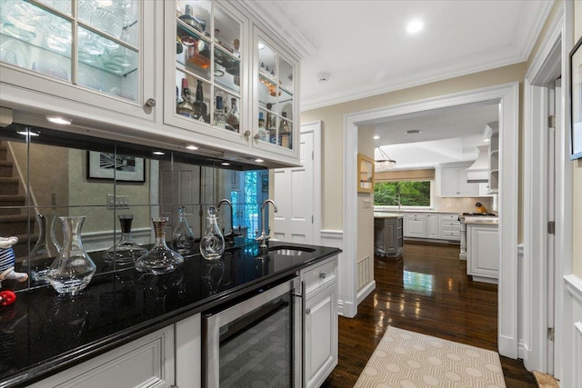 35 Seville Ave, Rye, NY 10580 - indoor bar featuring wine cooler, dark wood-type flooring, and crown molding