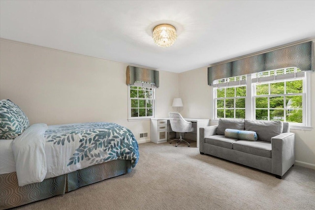 35 Seville Ave, Rye, NY 10580 - carpeted bedroom with multiple windows, a desk, and baseboards