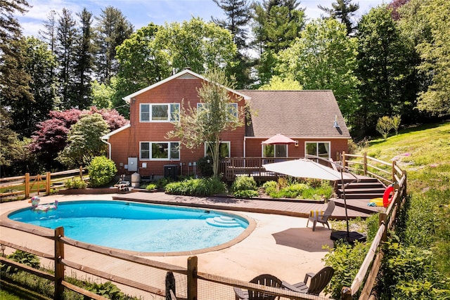 135 Turk Hill Rd, Carmel, NY 10509 - swimming pool with a wooden deck and view of wooded area