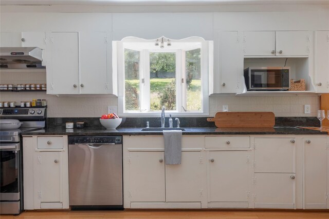 135 Turk Hill Rd, Carmel, NY 10509 - kitchen featuring appliances with stainless steel finishes, a sink, white cabinetry, and under cabinet range hood