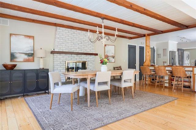 135 Turk Hill Rd, Carmel, NY 10509 - dining space featuring beam ceiling, wood-type flooring, and a chandelier