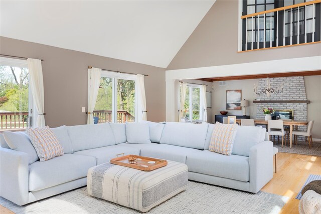135 Turk Hill Rd, Carmel, NY 10509 - living area featuring wood finished floors, high vaulted ceiling, and baseboards