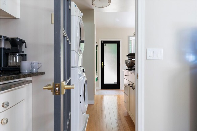 135 Turk Hill Rd, Carmel, NY 10509 - hall featuring stacked washer and clothes dryer, light wood-style flooring, and baseboards