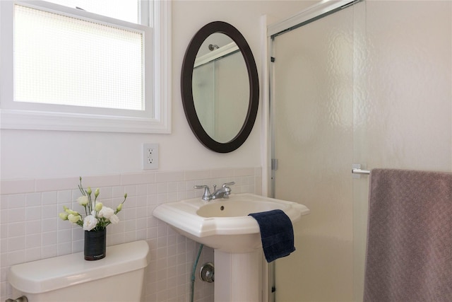 135 Turk Hill Rd, Carmel, NY 10509 - bathroom featuring toilet, tile walls, and a stall shower