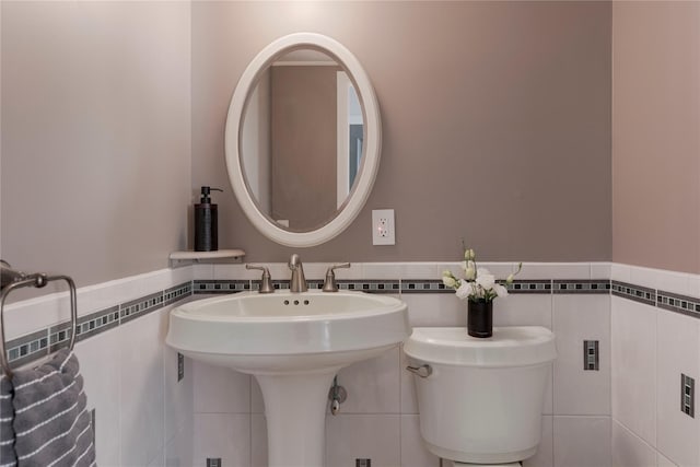 135 Turk Hill Rd, Carmel, NY 10509 - half bath featuring tile walls, wainscoting, and toilet