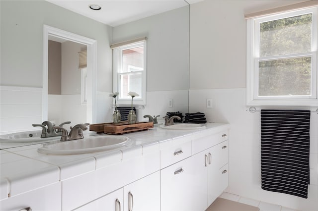 135 Turk Hill Rd, Carmel, NY 10509 - bathroom with double vanity and tile walls