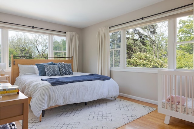 135 Turk Hill Rd, Carmel, NY 10509 - bedroom featuring wood finished floors, multiple windows, and baseboards