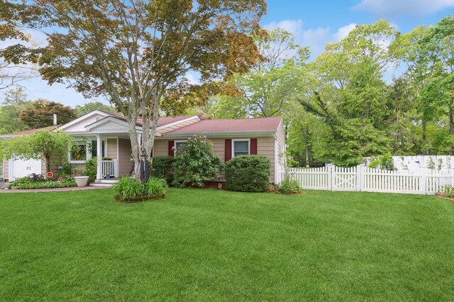 22 Ridge Rd, Shirley, NY 11967 - view of front of home featuring a garage and covered porch