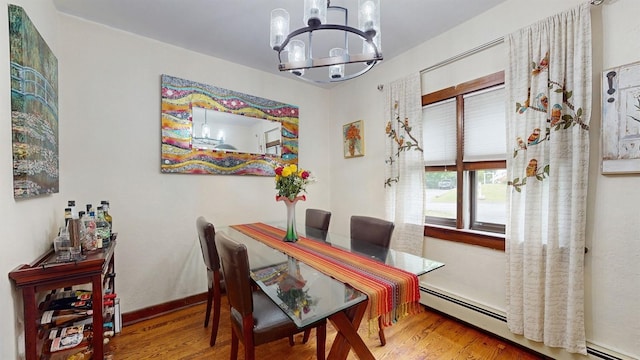 3 Byram Ridge Rd S, Armonk, NY 10504 - dining space with baseboard heating, a chandelier, and wood finished floors