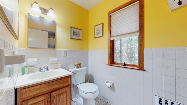 3 Byram Ridge Rd S, Armonk, NY 10504 - bathroom with tile walls, toilet, tile patterned flooring, wainscoting, and vanity