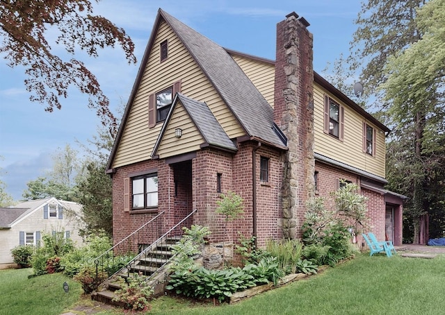3 Byram Ridge Rd S, Armonk, NY 10504 - view of home's exterior featuring brick siding, a chimney, and a yard