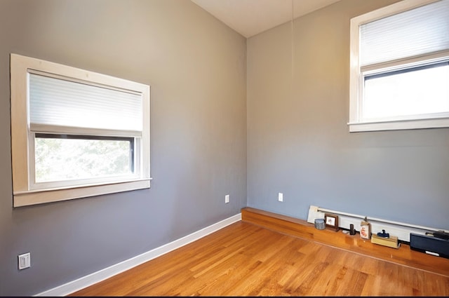 3 Byram Ridge Rd S, Armonk, NY 10504 - spare room featuring wood finished floors and a baseboard radiator