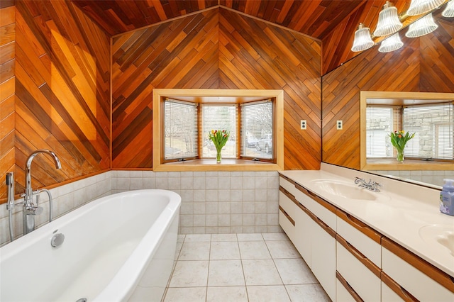 11-13 Eldridge Ln, Red Hook, NY 12571 - bathroom with vaulted ceiling, double vanity, a soaking tub, tile patterned floors, and wooden ceiling
