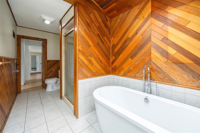 11-13 Eldridge Ln, Red Hook, NY 12571 - full bath featuring a stall shower, tile patterned floors, a freestanding tub, wooden walls, and a wainscoted wall