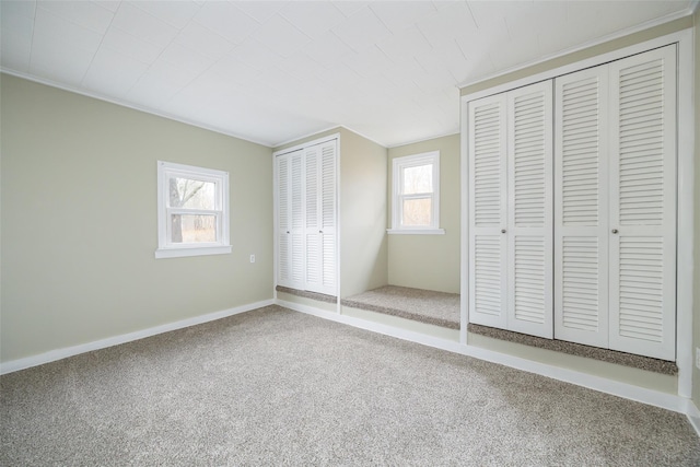 11-13 Eldridge Ln, Red Hook, NY 12571 - unfurnished bedroom with carpet, multiple closets, and baseboards
