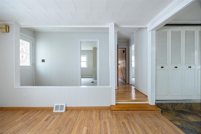 11-13 Eldridge Ln, Red Hook, NY 12571 - empty room with wood finished floors, baseboards, and ornamental molding