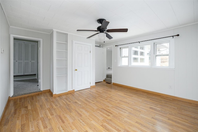 11-13 Eldridge Ln, Red Hook, NY 12571 - unfurnished bedroom featuring ornamental molding, light wood-type flooring, baseboards, and a ceiling fan