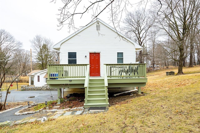 11-13 Eldridge Ln, Red Hook, NY 12571 - view of front of home with a wooden deck and a front lawn