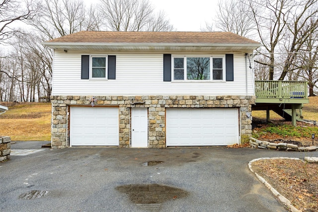 11-13 Eldridge Ln, Red Hook, NY 12571 - garage featuring asphalt driveway