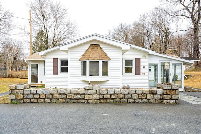 11-13 Eldridge Ln, Red Hook, NY 12571 - view of front facade featuring a chimney and a shingled roof