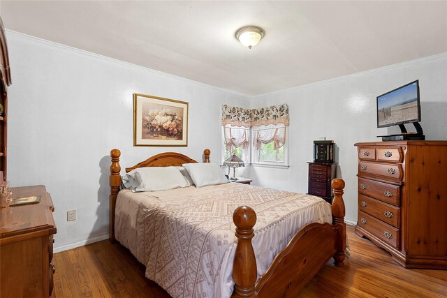 658 Northville Tpke, Riverhead, NY 11901 - bedroom with wood finished floors, ornamental molding, and baseboards