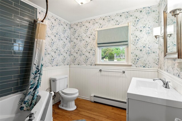 658 Northville Tpke, Riverhead, NY 11901 - full bath with baseboard heating, wood finished floors, toilet, wainscoting, and crown molding