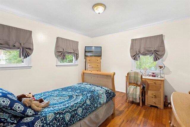 658 Northville Tpke, Riverhead, NY 11901 - bedroom featuring wood finished floors and baseboards