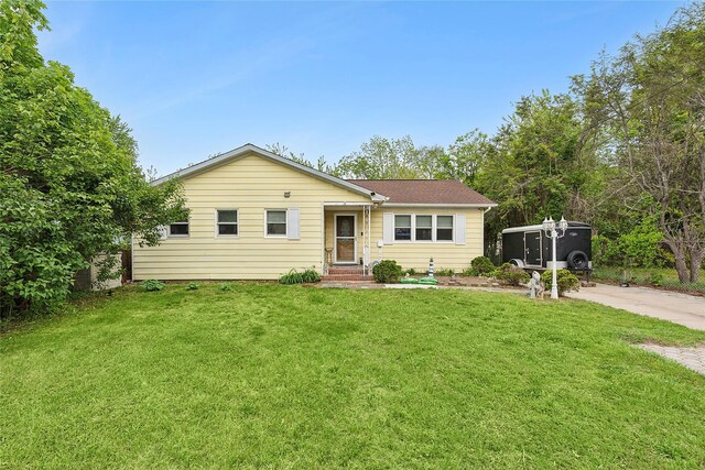 658 Northville Tpke, Riverhead, NY 11901 - view of front of house featuring a front lawn