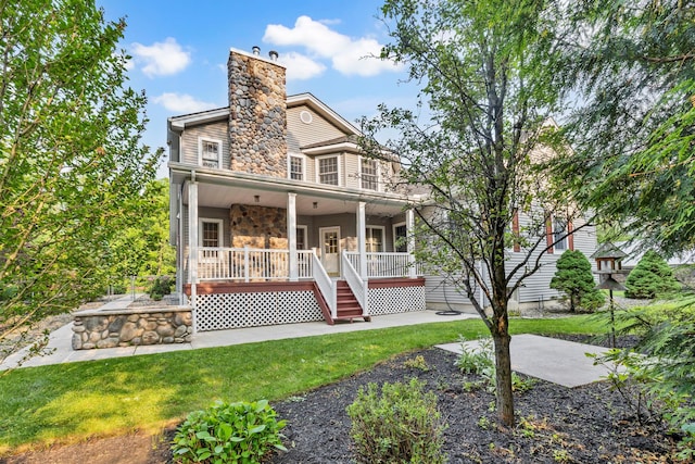 9 Joseph Bow Ct, Pearl River, NY 10965 - view of front facade featuring a patio, a chimney, stone siding, and a front yard