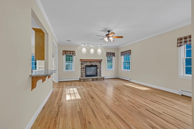 9 Joseph Bow Ct, Pearl River, NY 10965 - unfurnished living room featuring a baseboard heating unit, crown molding, a stone fireplace, ceiling fan, and light wood-type flooring