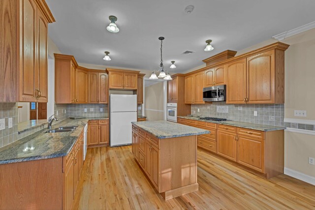 9 Joseph Bow Ct, Pearl River, NY 10965 - kitchen featuring stainless steel appliances, decorative backsplash, stone counters, and light wood-style floors