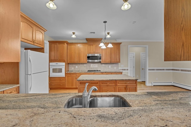 9 Joseph Bow Ct, Pearl River, NY 10965 - kitchen with white appliances, ornamental molding, light stone countertops, hanging light fixtures, and decorative backsplash